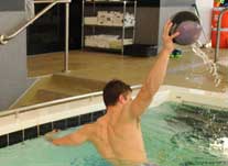 patient in pool with ball